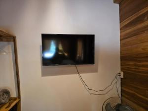 TV a/nebo společenská místnost v ubytování Nueva Tierra