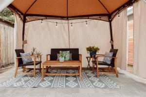 a gazebo with two chairs and a wooden table at Walk to Beach and Restaurants - Super Clean! in Long Beach