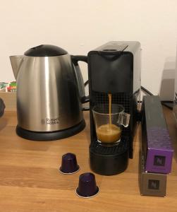 a coffee maker and a blender on a table at Casa de Mama in Trieste +13 photos