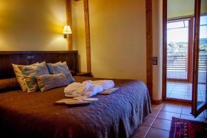 Ένα ή περισσότερα κρεβάτια σε δωμάτιο στο Mas del Bot
