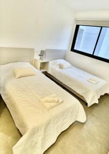 Cama o camas de una habitación en A dos cuadras del Paseo la Galería