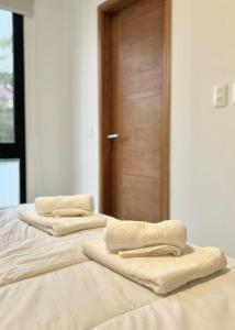 Cama o camas de una habitación en A dos cuadras del Paseo la Galería