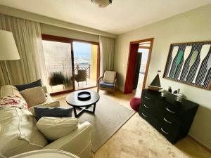 a living room with a couch and a table at Hotel en Samana con vista al Mar in Sabana