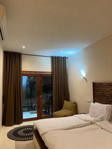 Voodi või voodid majutusasutuse Lombok Coconut Hotel toas