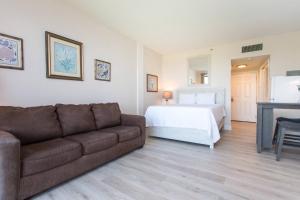 a living room with a couch and a bed at Pirates Bay Condominiums Unit 302A in Fort Walton Beach