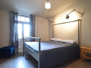 a bedroom with a bed and a window at Gutshofblick L in Hanshagen