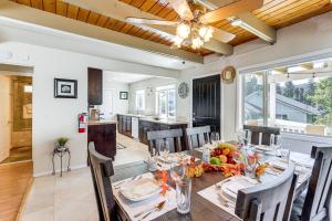 a dining room with a table with fruit on it at Home with 2 Decks - 2 Mi to Lake Gregory Dog Park! in Crestline