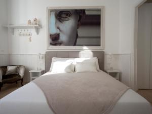 Posteľ alebo postele v izbe v ubytovaní Primo Piano Suites