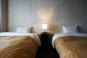 Hotel Chino客房内的一张或多张床位