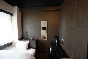 Hotel Chino客房内的一张或多张床位