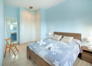 a bedroom with a bed with two towels on it at Mar Bona in Tamariu +16 photos