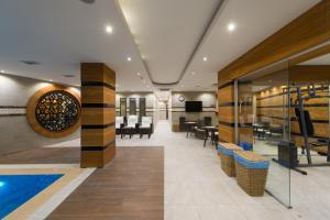 a lobby with a pool and tables and chairs at Antea Hotel Oldcity -Special Category in Istanbul