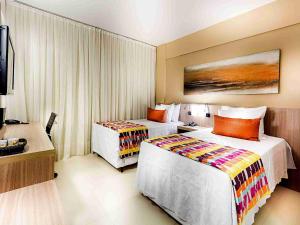 Cama ou camas em um quarto em Quality Hotel Pampulha & Convention Center