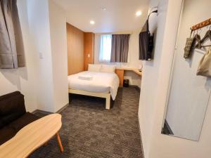 Postel nebo postele na pokoji v ubytování Softlight Inn Asakusa Tokyo