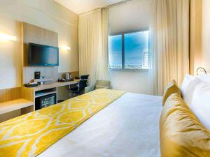 Cama ou camas em um quarto em Quality Hotel Pampulha & Convention Center
