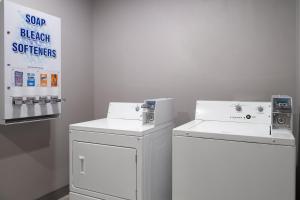 a laundry room with two washers and a dryer at Holiday Inn Express Toledo North by IHG in Toledo +34 photos