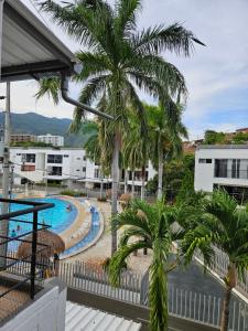 a view of the pool from the balcony of a resort at Apartasol Ciudadela Santa Fé "El Refugio" in Santa Fe de Antioquia