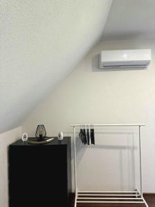a room with a ceiling with a fan at Glück Apartments (Europa-Park Rust) in Kappel-Grafenhausen +6 photos