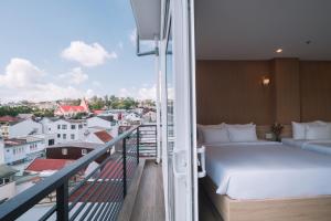 Postel nebo postele na pokoji v ubytování HOANG LINH PHAT HOTEL + 37 fotografií