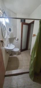 a bathroom with a toilet and a sink at Bonito Departamento Amueblado y se factura in Guaymas