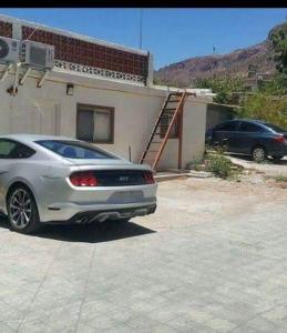 a white car parked in front of a house at Bonito Departamento Amueblado y se factura in Guaymas