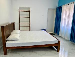 Uma cama ou camas num quarto em Havelock City Hostel, Colombo