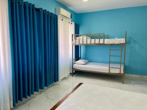 Uma cama ou camas num quarto em Havelock City Hostel, Colombo