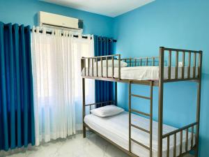 Uma cama ou camas num quarto em Havelock City Hostel, Colombo