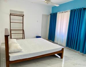 Uma cama ou camas num quarto em Havelock City Hostel, Colombo