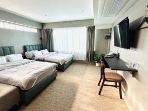 Ein Bett oder Betten in einem Zimmer der Unterkunft Nonoteru Chiangmai