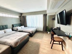 Ein Bett oder Betten in einem Zimmer der Unterkunft Nonoteru Chiangmai