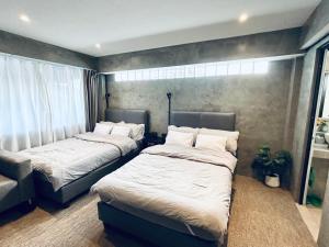 Ein Bett oder Betten in einem Zimmer der Unterkunft Nonoteru Chiangmai