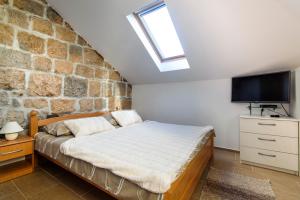 Postel nebo postele na pokoji v ubytování La Perla Luxury Apartments