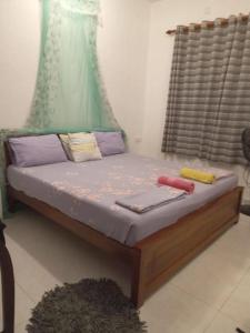 Llit o llits en una habitació de Weerakoon Garden Guest