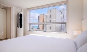 Postel nebo postele na pokoji v ubytování POL-A Resort Haeundae