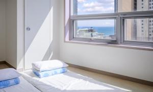 Postel nebo postele na pokoji v ubytování POL-A Resort Haeundae + 24 fotografií