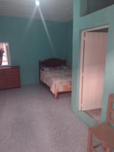 Postel nebo postele na pokoji v ubytování Hostal Eclipse Oaxaca