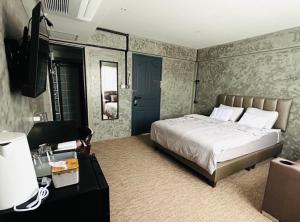 Ein Bett oder Betten in einem Zimmer der Unterkunft Nonoteru Chiangmai