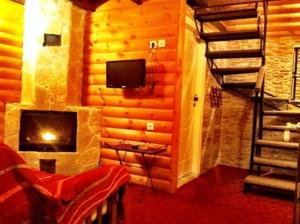 TV a/nebo společenská místnost v ubytování Stivakti Chalet
