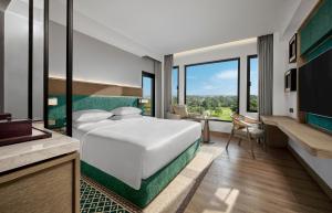 Postelja oz. postelje v sobi nastanitve Hyatt Regency Yogyakarta