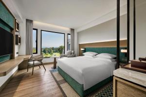 Postelja oz. postelje v sobi nastanitve Hyatt Regency Yogyakarta