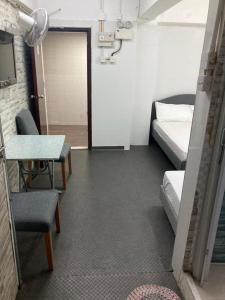 Katil atau katil-katil dalam bilik di Ajit guest house