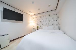 Cama o camas de una habitación en Kyoung Dong Hotel Myeongdong