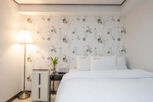 Cama o camas de una habitación en Kyoung Dong Hotel Myeongdong