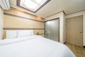Cama o camas de una habitación en Kyoung Dong Hotel Myeongdong