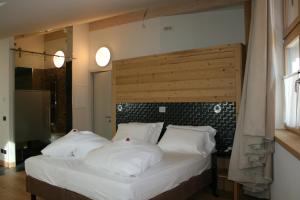 Postel nebo postele na pokoji v ubytování Hotel Orso Grigio