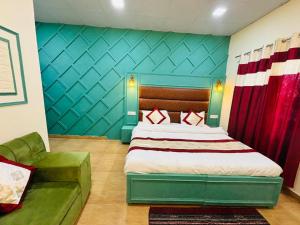 Ένα ή περισσότερα κρεβάτια σε δωμάτιο στο Hotel Amar