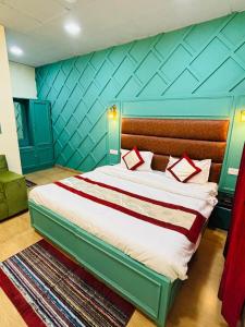 Ένα ή περισσότερα κρεβάτια σε δωμάτιο στο Hotel Amar