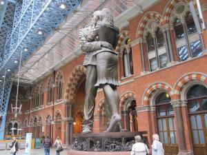 a statue of a man hugging a woman in a building at Alhambra Hotel in London
