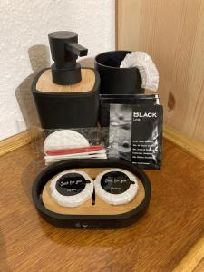 a counter top with a black appliance with glasses on it at Gîte d'Avalon Chambre 7 in Dinant +28 photos